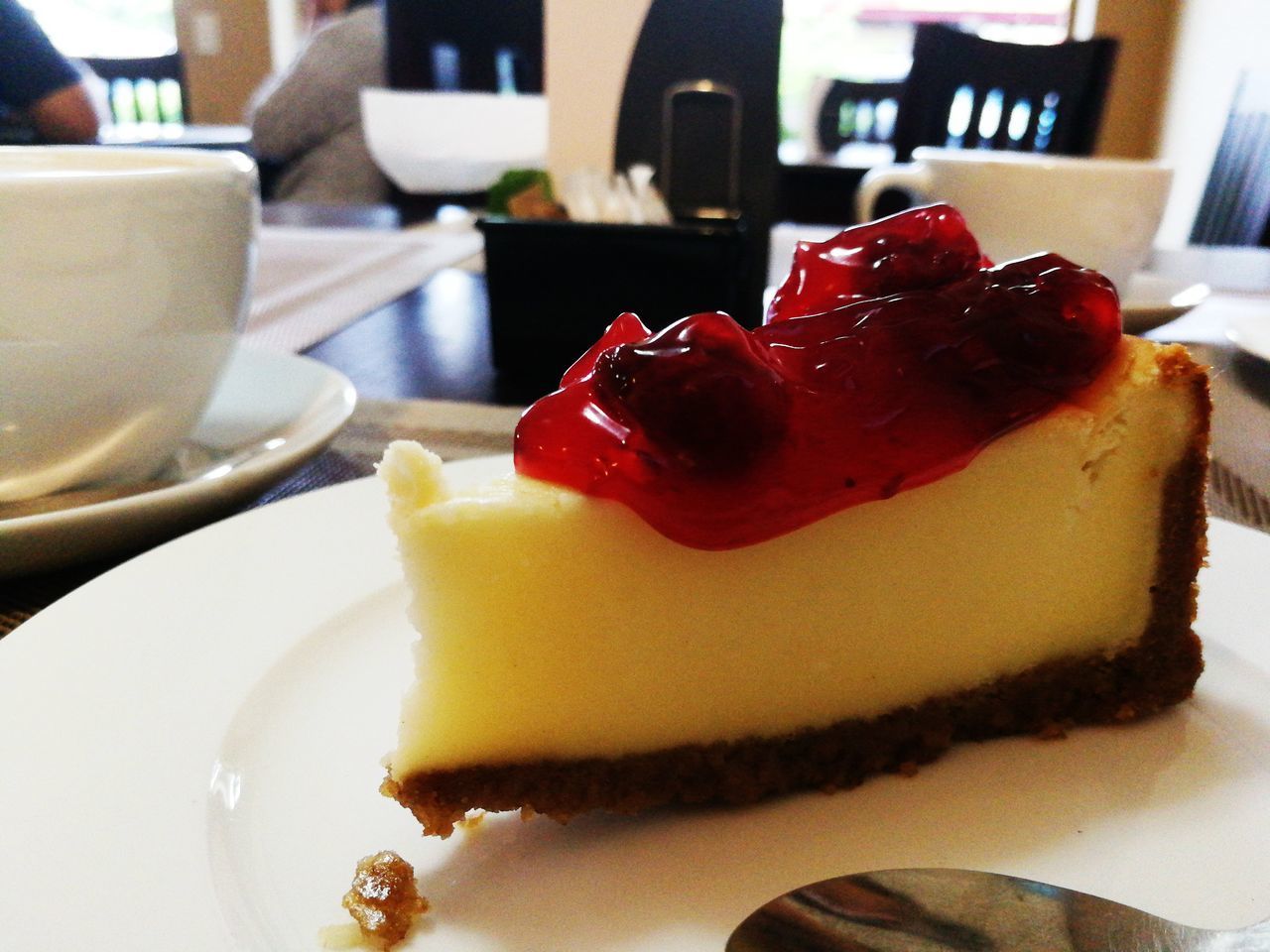 CLOSE-UP OF SERVED CAKE SLICE IN PLATE