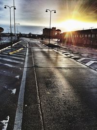 Road in city at sunset