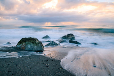 Scenic view of sea against sky during sunset