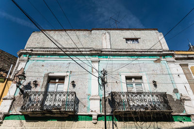 Low angle view of old building against sky