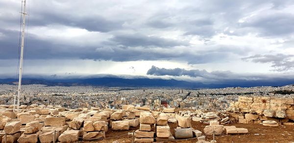 Panoramic view of building and landscape against sky