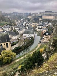 High angle view of river amidst buildings in luxembourg city