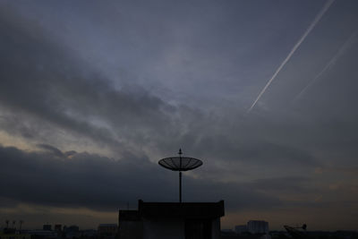 Low angle view of street light against sky during sunset