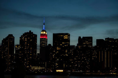 Illuminated buildings in city at night