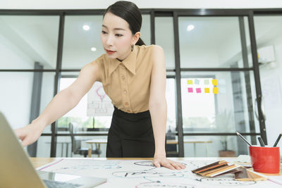 Young woman working on table