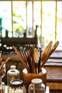 Close-up of paintbrushes on table