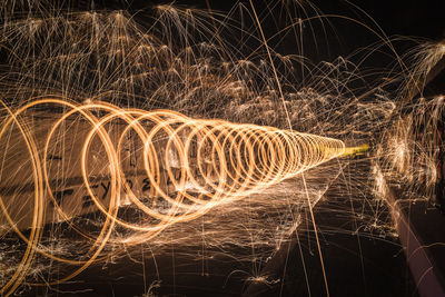 Close-up of illuminated light trails at night