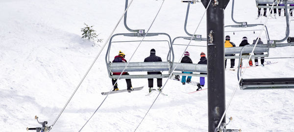 High angle view of people on snow covered landscape