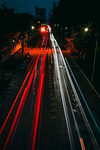 High angle view of light trails on road at night