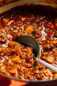 Paleo chili con carne cooking in a dutch oven