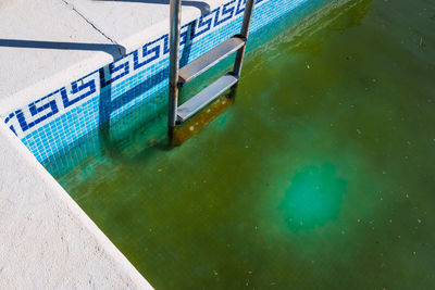 High angle view of swimming pool by building