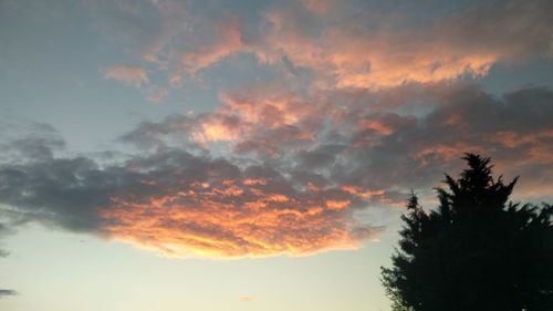 Low angle view of cloudy sky at sunset