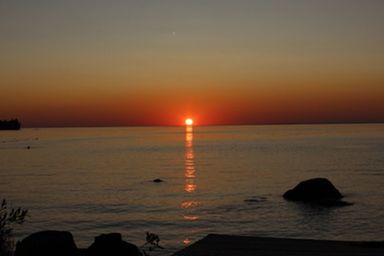 Scenic view of sea against sky during sunset