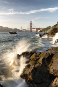 View of suspension bridge over sea