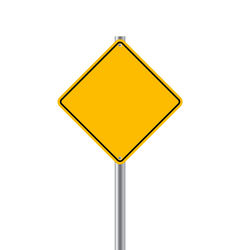 Close-up of yellow sign against white background