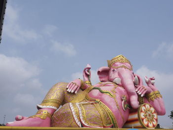 Low angle view of statue against sky