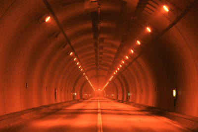 View of empty illuminated tunnel