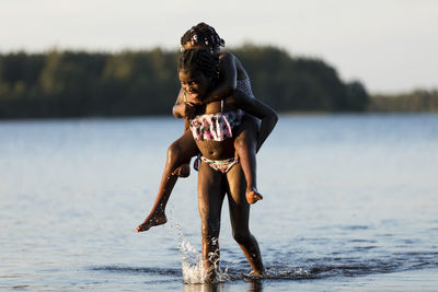 Girls playing in lake