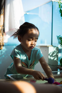 Cute boy playing at home
