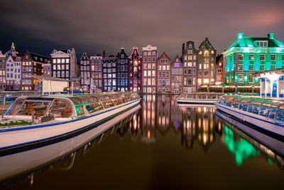 Reflection of buildings in city at night