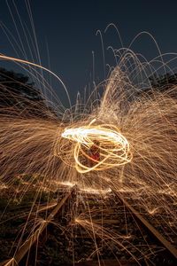 Light trails against sky at night