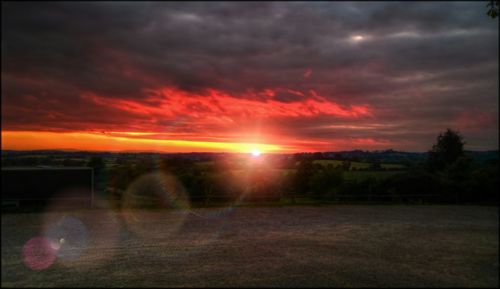 Scenic view of landscape against cloudy sky