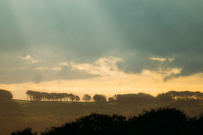 Scenic view of silhouette landscape against sky during sunset