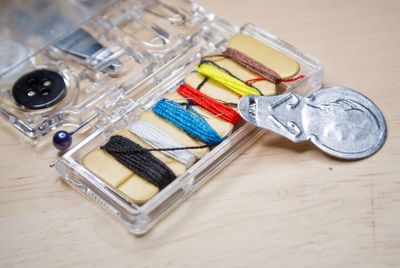 Close-up of sewing items on table