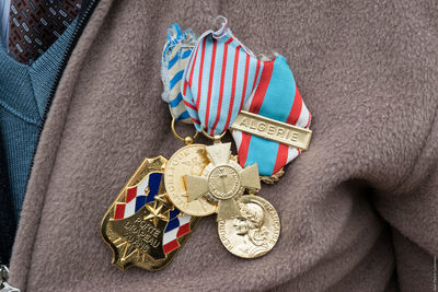 Midsection of male soldier wearing medals