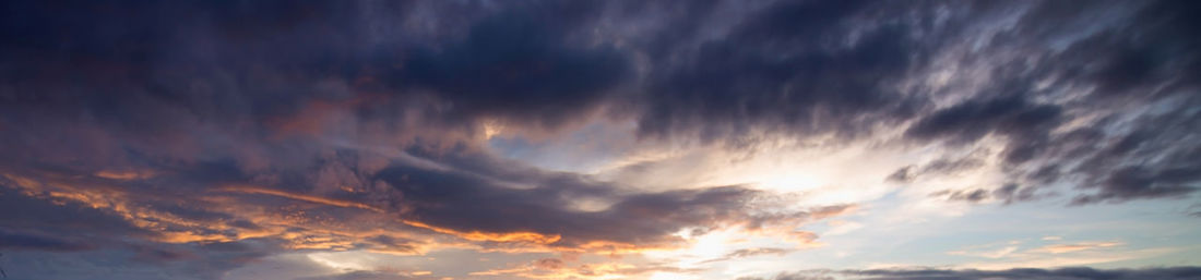 Low angle view of dramatic sky during sunset