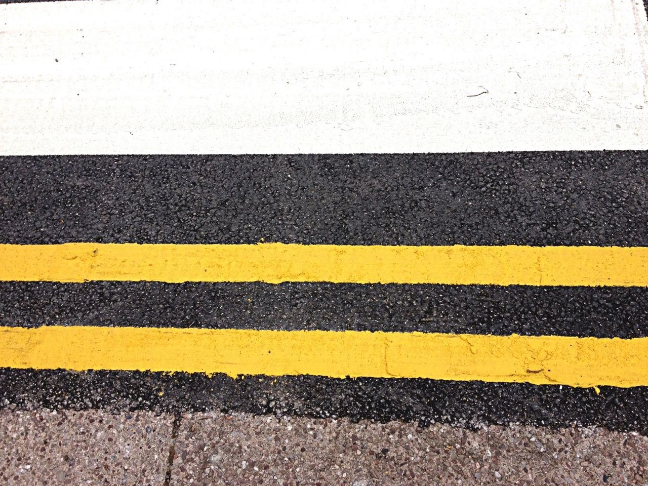 full frame, road marking, pattern, textured, backgrounds, street, high angle view, asphalt, yellow, road, day, outdoors, transportation, close-up, striped, no people, detail, sunlight, design, white color