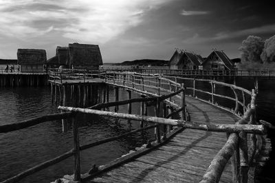 Pier over sea against sky