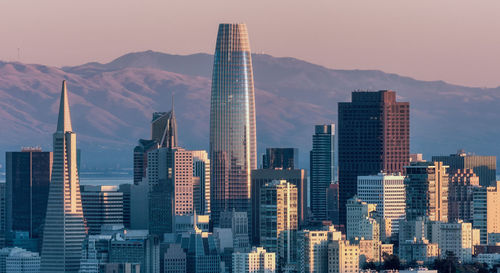 Modern buildings in city against sky