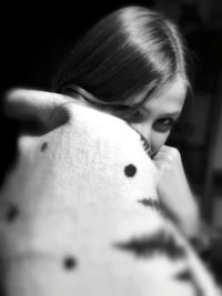 Close-up portrait of a young woman drinking water