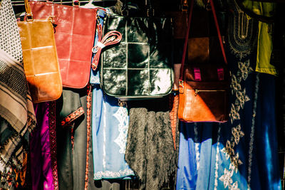Low angle view of clothes hanging at market stall