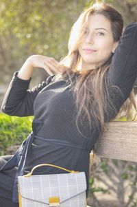 Portrait of smiling young woman outdoors