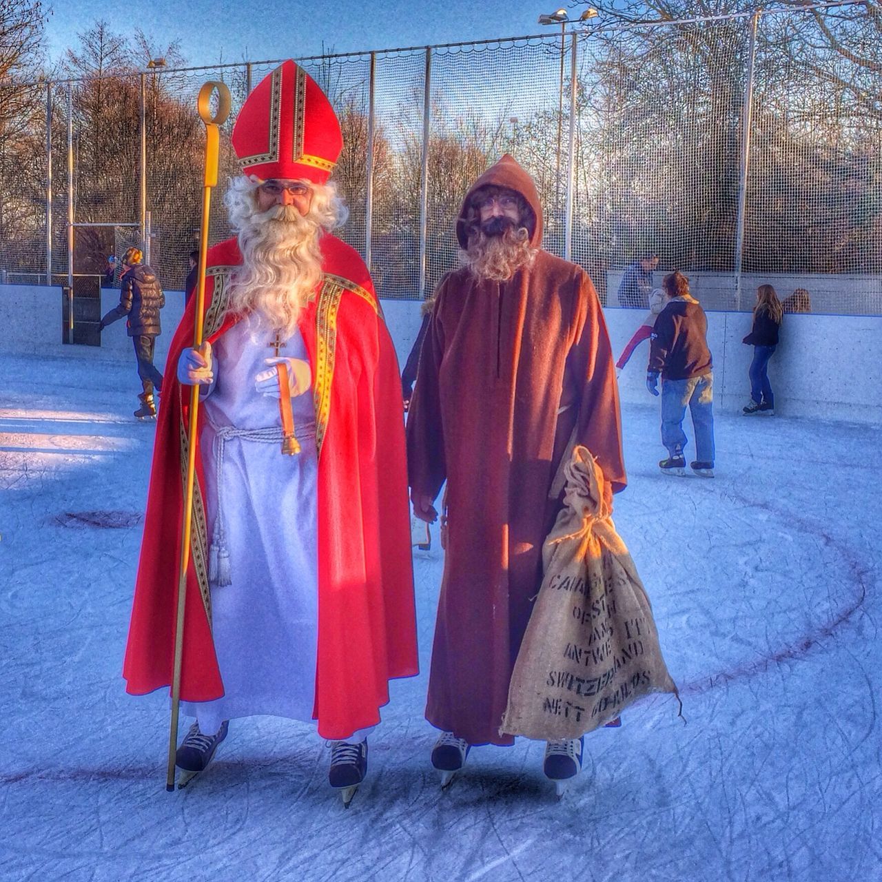 lifestyles, leisure activity, person, large group of people, traditional clothing, men, casual clothing, togetherness, cultures, red, full length, standing, mixed age range, celebration, tradition, outdoors, enjoyment, rear view, day