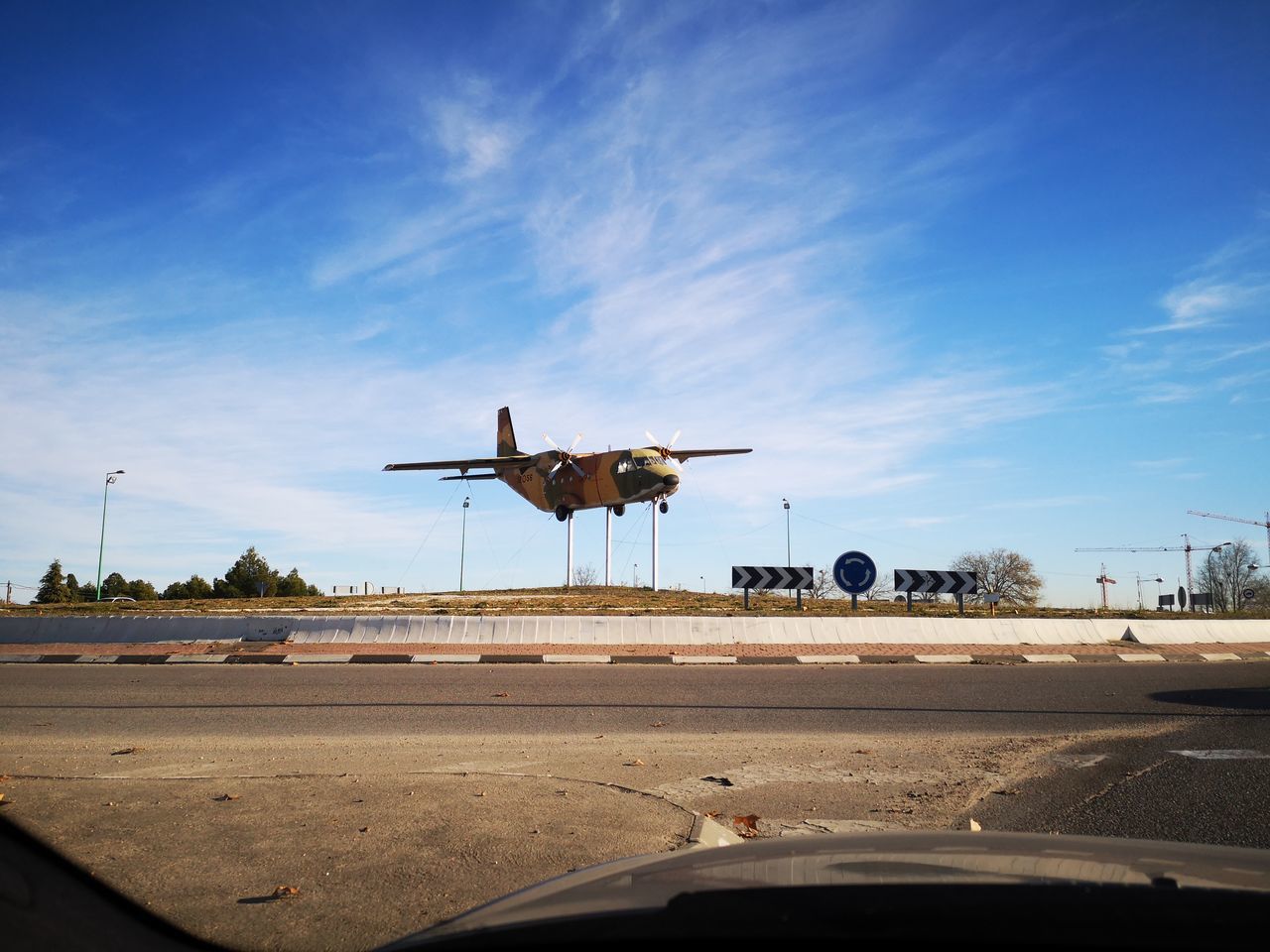 mode of transportation, transportation, sky, air vehicle, vehicle interior, car, airplane, windshield, road, cloud - sky, transparent, motor vehicle, land vehicle, glass - material, nature, car interior, no people, airport, travel, motion, outdoors, car point of view, plane