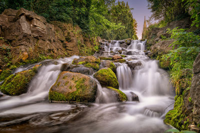 Scenic view of waterfall in forest