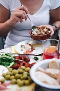 Midsection of woman having food