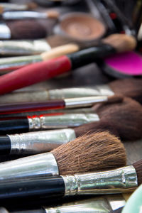 High angle view of make-up brushes on table