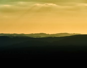 Scenic view of silhouette landscape against sky during sunset