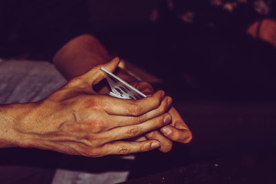 Close-up of man holding hands