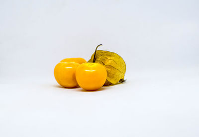 Close-up of fruits against white background