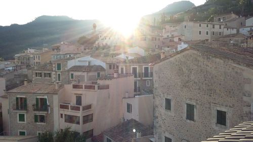 Houses in town against mountains