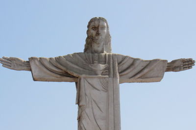 Low angle view of statue against sky