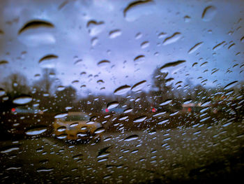 Close-up of raindrops on glass window