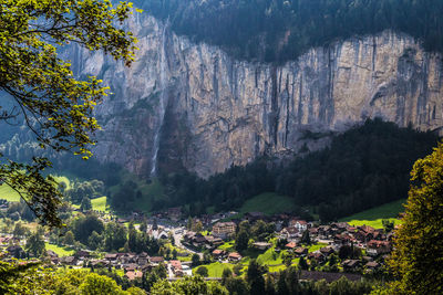 Scenic view of trees and mountains against sky