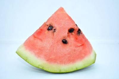 Close-up of strawberry slices over white background