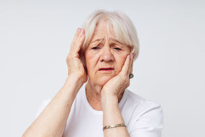 Senior woman having tooth ache